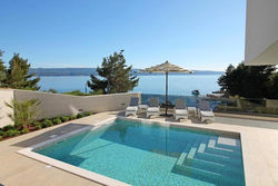 Luxury, seafront Villa Petra with heated pool only 50m from beach