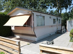 Nice mobile home with enclosed garden in Friesland